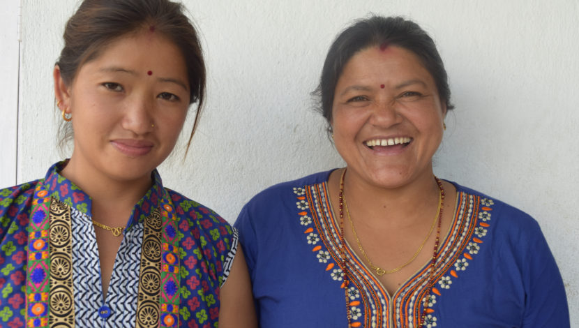 Two women smiling