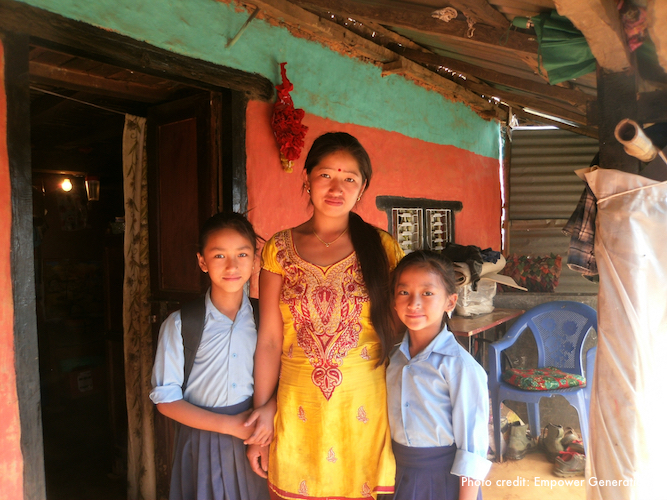 Nepalese woman with two children at her side.