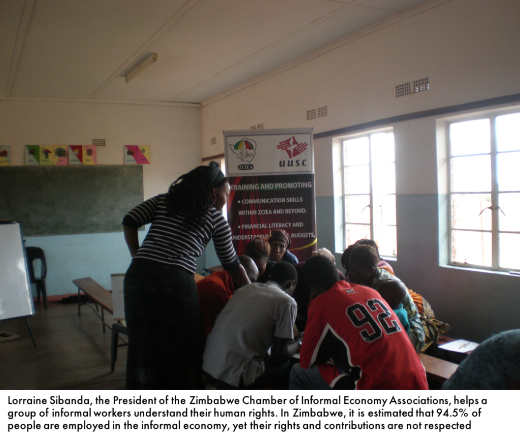 ZCIEA President Lorraine Sibanda with informal traders at a UUSC-funded training on human rights in Victoria Falls