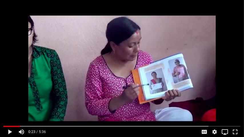 Nepali woman holding book