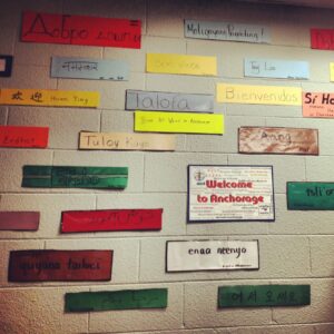 A wall filled with the phrase "hello" in different languages across the world