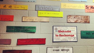 A wall filled with the phrase "hello" in different languages across the world