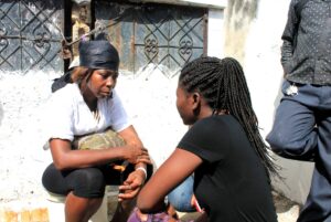 Two women conversing with one another