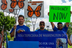 A group of people at a TPS demonstration in Washington DC