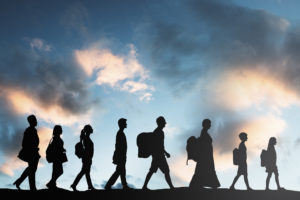ilhouette Of Refugees People With Luggage Walking In A Row