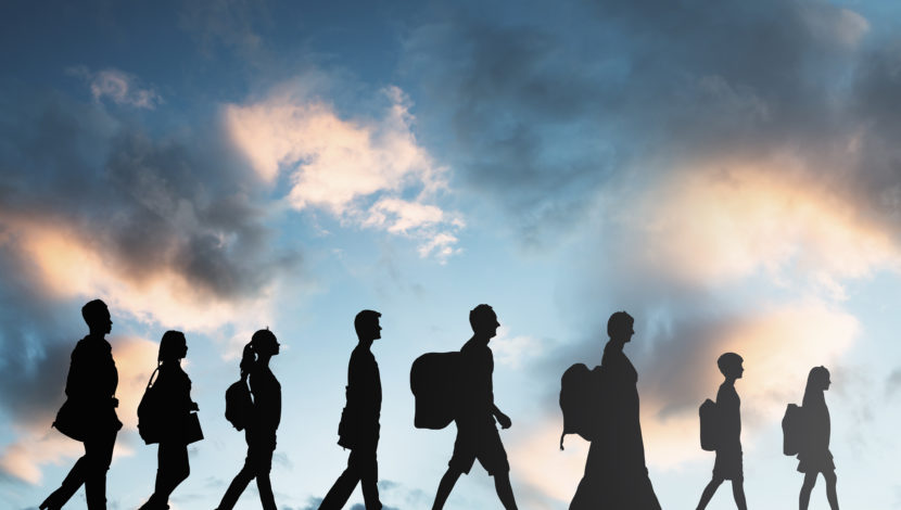 ilhouette Of Refugees People With Luggage Walking In A Row