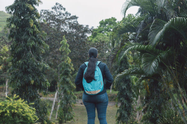 A young woman walking in a forest