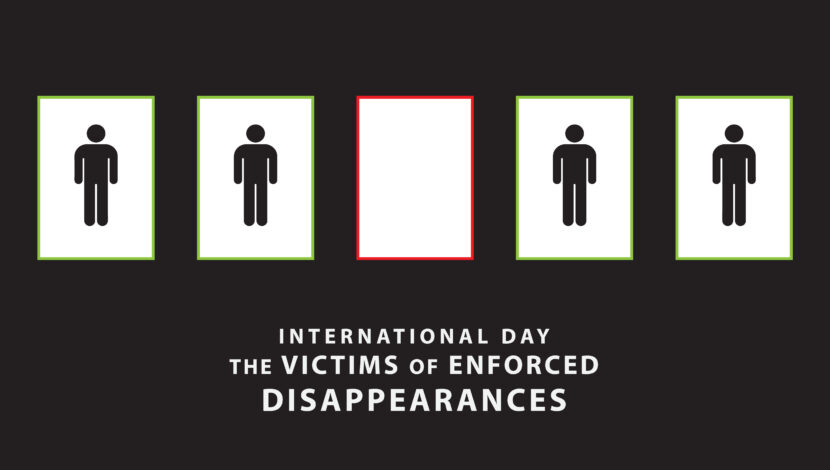 A group of people standing in boxes above "International Day of the Victims of Enforced Disappearances"