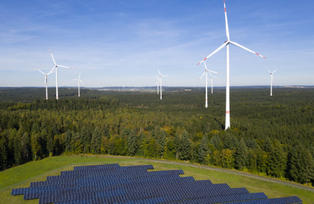 Wind power plant with solar panels