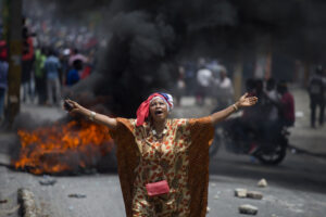 A protester yells anti-government slogans during an anti-corruption protest to demand the resignation of the president Jovenel Moise in Port-au-Prince