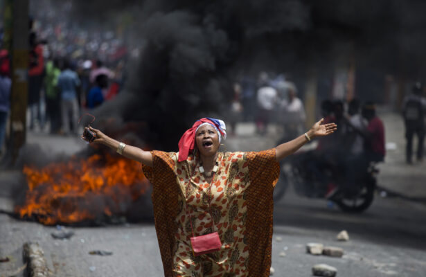 A protester yells anti-government slogans during an anti-corruption protest to demand the resignation of the president Jovenel Moise in Port-au-Prince