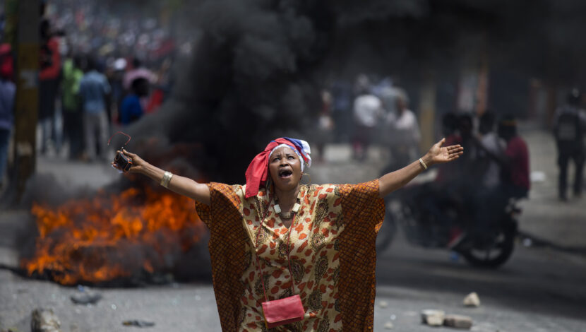 A protester yells anti-government slogans during an anti-corruption protest to demand the resignation of the president Jovenel Moise in Port-au-Prince