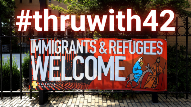 A sign in front of church welcoming immigrants and refugees with #thruwith42 above