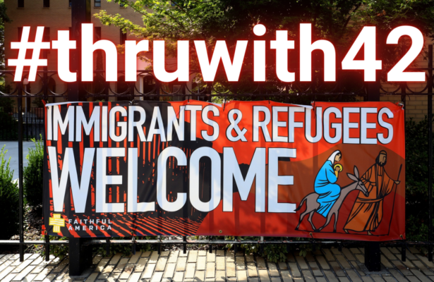 A sign in front of church welcoming immigrants and refugees with #thruwith42 above