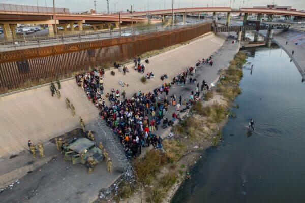 Texas National Guard troops block migrants at a border crossing along the Rio Grande in El Paso, Texas on December 20.