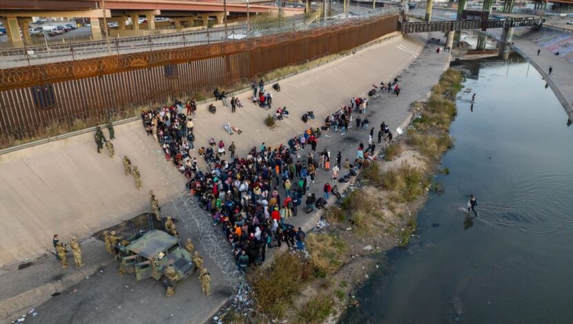 Texas National Guard troops block migrants at a border crossing along the Rio Grande in El Paso, Texas on December 20.