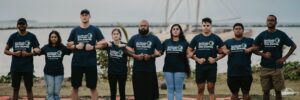 A group of climate activists forming a chain through linking arms