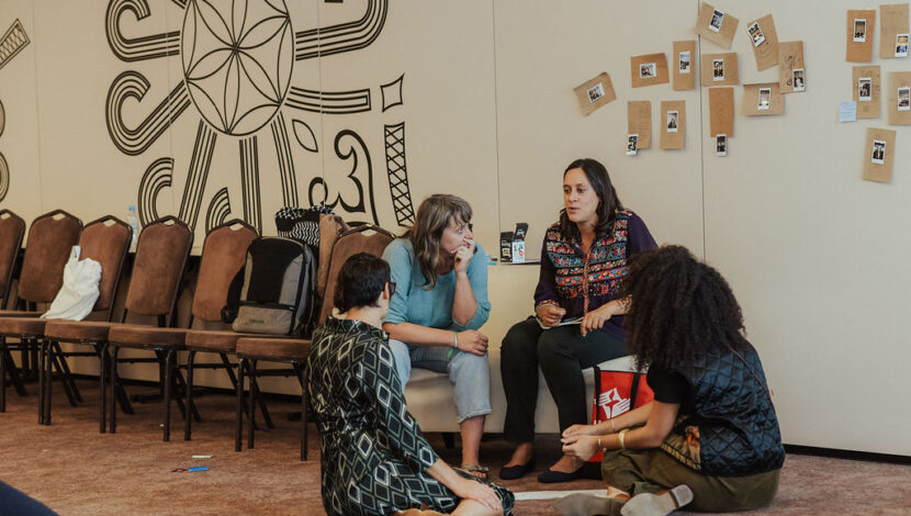 UUSC staff member speaks with fellow funders.