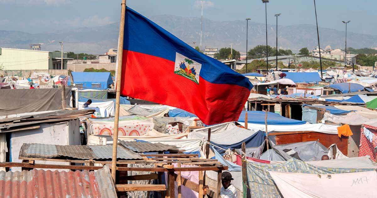 Haitian flag flies over refugee camp in Port-au-Prince