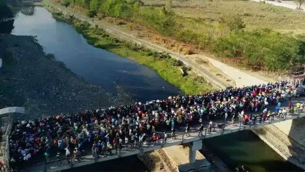 Immigrants crossing bridge
